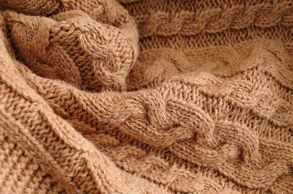 KNITTED BRAIDED SWEATER